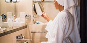 Magnifying mirrors in hotel bathrooms reveal every pore.