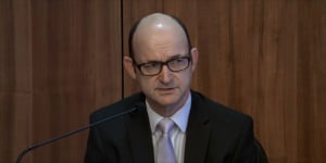 Victoria Police's head of legal services Findlay McRae gives evidence at the royal commission