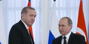 Russian President Vladimir Putin,right,and Turkish President Recep Tayyip Erdogan shake hands at a news conference after their talks in the Konstantin palace outside St.Petersburg in Russia.