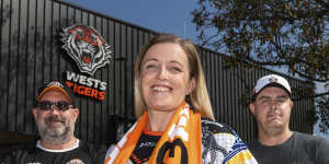 Joel Helmes (left) with fellow Wests Tigers fans and podcasters Kelly Hollis and Eddie Otto.