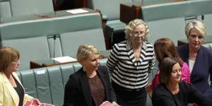 Shadow Education Minister and Shadow Minister for Women Tanya Plibersek (far right) with colleagues tables a petition from the March 4 Justice protest in the House of Representatives.
