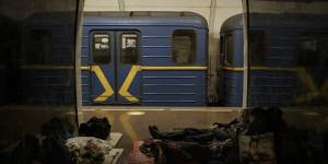 People rest in a subway station being used as a bomb shelter in Kyiv,Ukraine.