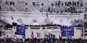 Insurrectionists loyal to then US president Donald Trump breach the Capitol in Washington on January 6,2021.