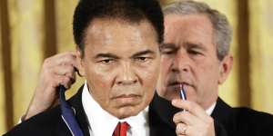 In 2009,US president George W Bush presents the Presidential Medal of Freedom to Muhammad Ali.