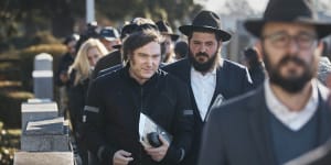 Argentina’s president-elect,Javier Milei,centre,leaves after praying next to rabbis at the resting place of Rabbi Menachem Mendel Schneerson in New York.