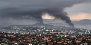 Smoke rises during protests in Noumea,New Caledonia.