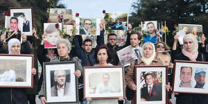 Syrian activist Noura Ghazi (centre) with a picture of her husband Bassel Khartabil at a ‘‘Families for Freedom’’ demonstration outside the UN’s office in Geneva in February 2017. 