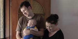 Adam and Naomi McGowen with their son Austin,three months,at their new home in Lismore Heights.