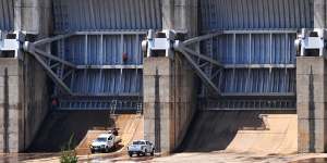 Work crews at the gates of Wyangala Dam:the business case for lifting the wall is yet to be made public.