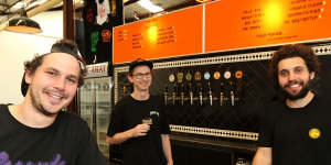Matt King (right) with mates Trent Evans (left) and Glenn Wignall in their Marrickville brewery,The Grifter Brewing Co.