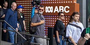 ABC staff stream out of their offices last month.