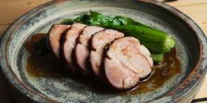 Slow-cooked pork neck with mustard greens.