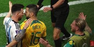 Messi tussles with Aziz Behich.