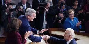 President Joe Biden arrives and shakes hands with House Speaker Kevin McCarthy before delivering his 2023 State of the Union address.