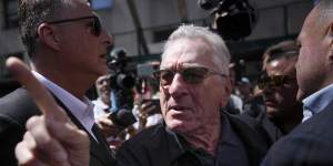 Robert De Niro,center,argues with a Trump supporter after speaking to reporters in support of Joe Biden