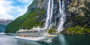 Viking Sky in front of the Seven Sisters Waterfall in Geiranger Fjord,Norway.