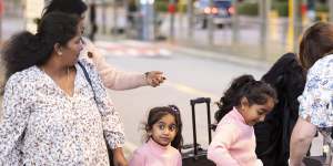 The happy Murugappan family arrive at Perth Airport on the way home to Biloela.