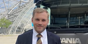 Norway’s transport state secretary Bent-Joacim Bentzen,in front of an electric truck,at the International Transport Forum’s annual summit in Leipzig,Germany.