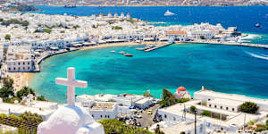 Mykonos town is a pretty Greek-island cliché of whitewashed cubic buildings and domed churches.