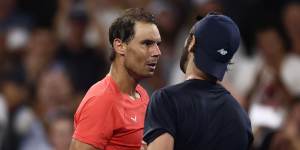 Rafael Nadal and Jordan Thompson shake hands after the match.