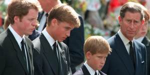Princess Diana's sons Princes William and Harry with their father Prince Charles and uncle Earl Spencer outside Westminster Abbey on the day of their mother's funeral,September 1997.