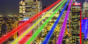 An artist’s impression of Yvette Mattern’s Global Rainbow,projected from the top of Sydney Tower.