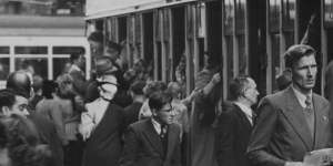 A crowded cram scene,Sydney,1947. Fare evasion had become rife.