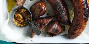 Barbecued sausages with red cabbage and mustard salad.