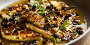 Grilled halloumi with honey,hazelnuts and currants.