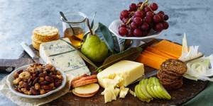 Create different heights to make a cheese plate look appealing.