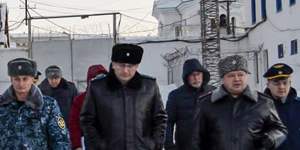 Russian officials walk inside the prison in Kharp,about 1900 kilometres north-east of Moscow,this month.