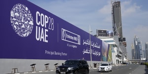 Cars pass by a billboard advertising COP28 at Sheikh Zayed highway in Dubai,United Arab Emirates,Monday,Nov. 27,2023. Representatives will gather at Expo City in Dubai,UAE,Nov. 30 to Dec. 12 for the 28th U.N. Climate Change Conference,known as COP28.