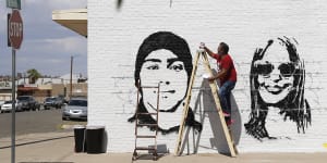 Manuel Oliver works on a mural in El Paso,Texas. It reads:The Americas belong to everyone". The shooting that killed 20 people on Saturday is being handled as a domestic terrorism case.