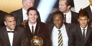 Brazil’s Dani Alves,Argentina’s Lionel Messi,Brazil’s soccer legend Pele and Brazil’s Neymar,from left,stand together after Messi was awarded the prize for the soccer player of the year 2011 at the FIFA Ballon d’Or ceremony in Zurich.