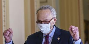 Senate Majority Leader Chuck Schumer pumps his fists in celebration after President Joe Biden’s $US1.9 trillion stimulus package passed the chamber. 