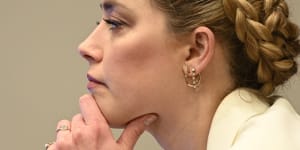 Amber Heard listens during the trial.
