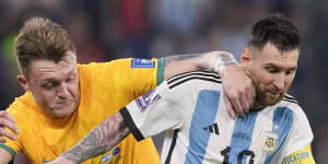 Harry Souttar tangles with Lionel Messi during the Socceroos’ round-of-16 loss to eventual champions Argentina in Qatar.