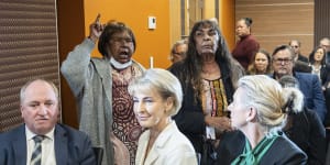 Indigenous members of the audience make their feelings known before opposition spokeswoman for Indigenous Australians,Senator Jacinta Nampijinpa Price,addresses the National Press Club in Canberra on September 14,2023,ahead of the Voice referendum. In the audience are prominent Coalition figures Barnaby Joyce,Michaelia Cash and Bridget McKenzie.