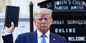 President Donald Trump holding a Bible outside St. John’s Church across Lafayette Park from the White House in Washington.