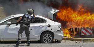 Missiles fired from Gaza set cars alight in the southern Israeli town of Ashkelon.