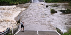 The Coomera River cuts off Clagiraba Road on the Gold Coast.