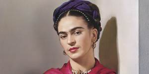 Frida Kahlo poses in a magenta shawl for the photographer Nickolas Muray in 1939.