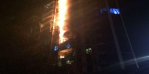 A fire caused by flammable cladding roars up the Lacrosse apartment building in Melbourne's Docklands.