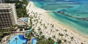 Aereal photo of Waikiki beach with view of Diamond Head mountain in the distance. iStock image for Traveller. Re-use permitted.