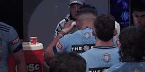 Origin players inhaling from buckets before the match.