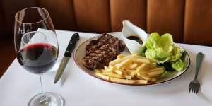 Steak frites is served with either bordelaise or bearnaise sauce and salad at Normandy Wine and Grill.