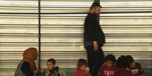 A Syrian family shares a meal at the Bardarash Refugee Camp in Iraqi Kurdistan. Iraq's deputy PM says the flood of Syrian refugees could cause a big problem for the country. 