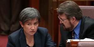 Senator Penny Wong and Senator Derryn Hinch during debate on the ABCC bill in the Senate at Parliament House in 2016. 