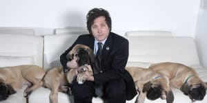 Argentinian President Javier Milei at home with his cloned mastiff puppies in 2018.