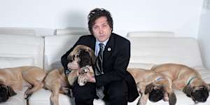 Argentinian President Javier Milei at home with his cloned mastiff puppies.